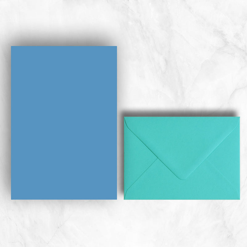 Plain lightly textured blue a5 sheets teamed with bright turquoise envelopes