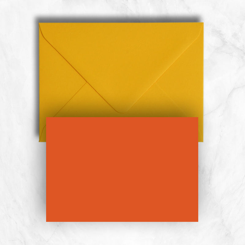 Plain lightly textured orange a6 cards teamed with citrine yellow envelopes