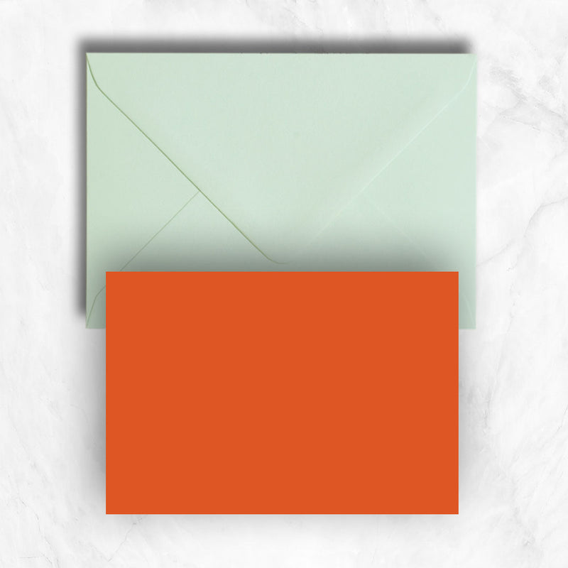 Plain lightly textured orange a6 cards teamed with powder green  envelopes