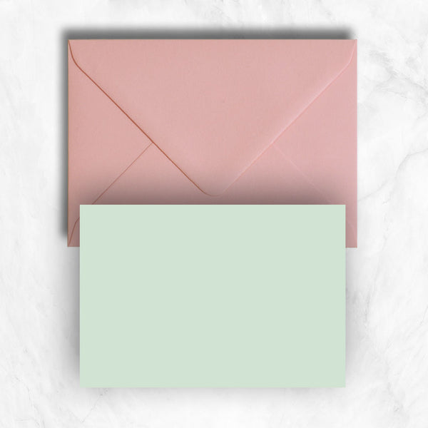 Plain lightly textured pastel powder green a6 cards teamed with candy pink envelopes