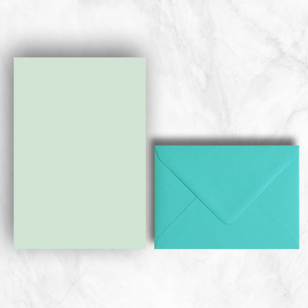 Plain lightly textured powder green a5 sheets teamed with turquoise blue envelopes