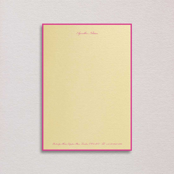 Elegantly bordered writing paper and the use of shocking pink font colour on the sorbet yellow paper is a true statement