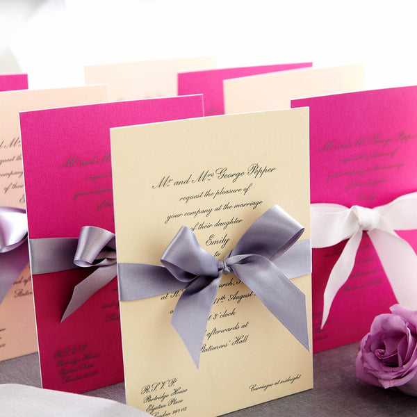 The Engraved Ascot Wedding invitations are finished with white edges and hand tied ribbons