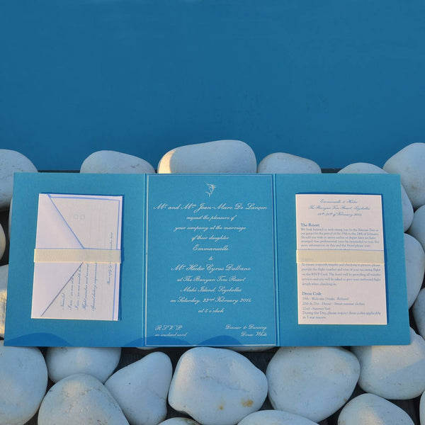 The Engraved Avani Wedding invitation folder laid out, revealing the wedding RSVP card and wedding information card