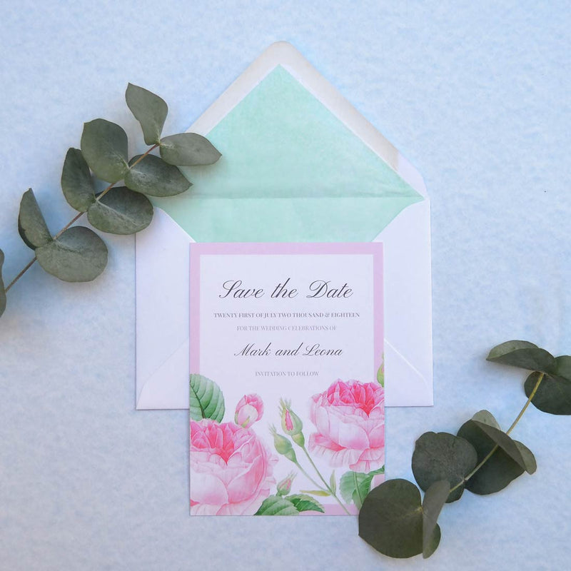 The Bamburgh save the date card designed with cool mint tissue linings for the envelopes