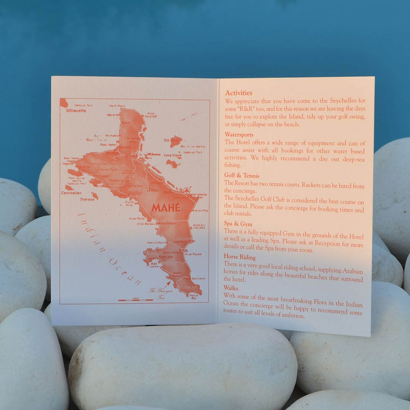 The Banyan wedding information card printed both sided of a folded card in matching Tangerine