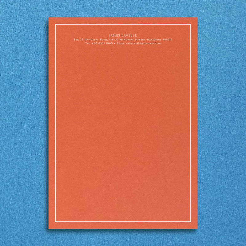 Bellevue Writing paper, shown with white ink printed onto a Mandarin orange writing sheet