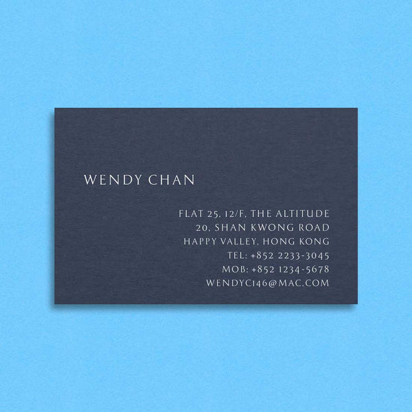 The Berkley engraved visiting card shows white ink on a blue card with personalisation left and right justified