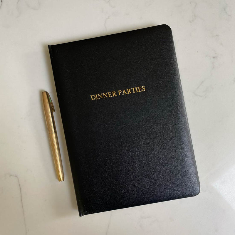 Our dinner party books are covered in a black leather cover which can be personalised
