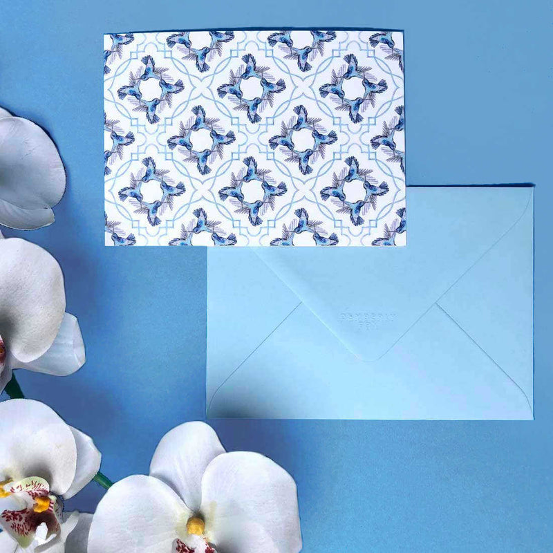 The blue hummingbird card, face down showing the diamond flapped matching blue envelope