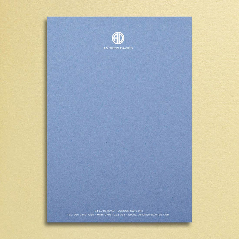 Bronte writing paper displays a contemporary monogram at the head and details at the foot, printed in white ink onto a new blue sheet