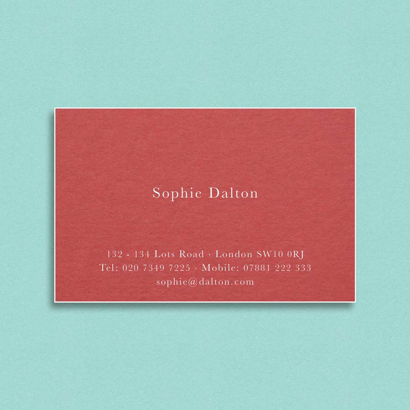 Engraved in white ink onto a contrasting vermillion card, the Buckingham visiting cards are finished with white edges