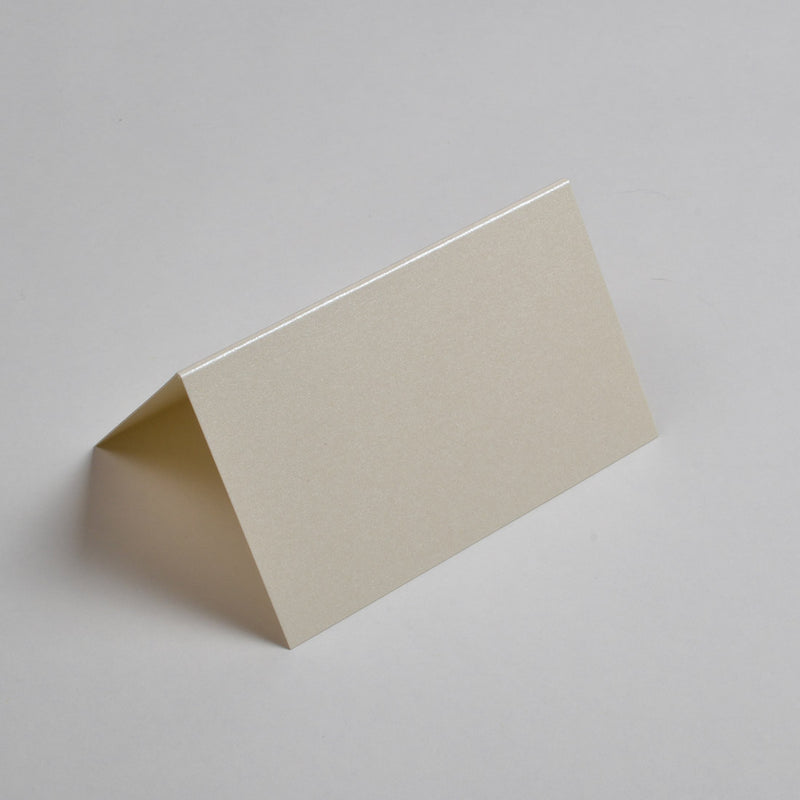The Candlelight Cream place cards are tent folded and smooth to the touch