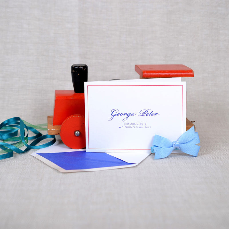 The Clifton personalised new baby cards, showing the font in blue and a contrasting red keyline border
