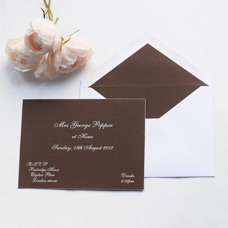 The Cliveden at home invitation cards, are engraved in white ink onto colorplan bagdad brown with white edges