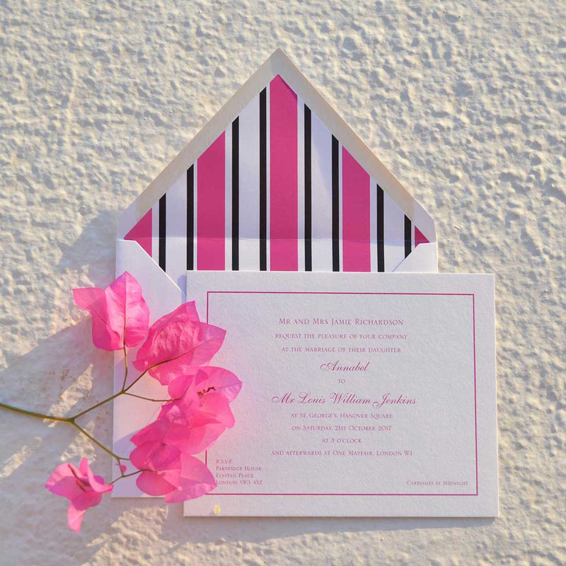 The Curzon wedding invitation, printed in shocking pink onto white card with its matching lined envelopes