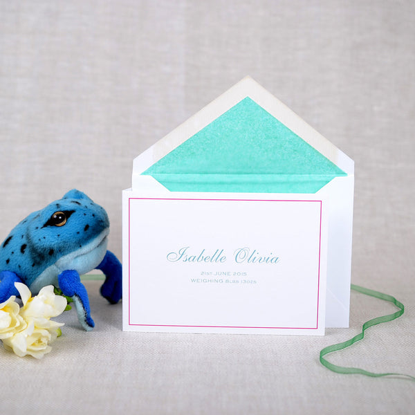 The folded Ellerby birth announcement cards and envelope with teal tissue paper lining
