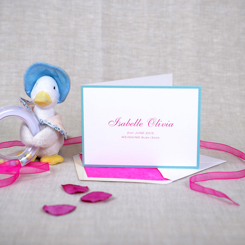 The Evershill personalised new baby cards, showing a teal border with shocking pink text on front cover