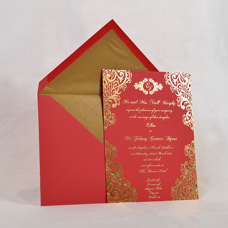 The fitzwilliam foiled wedding invitation is shown here on red card with its matching gold tissue lined envelopes