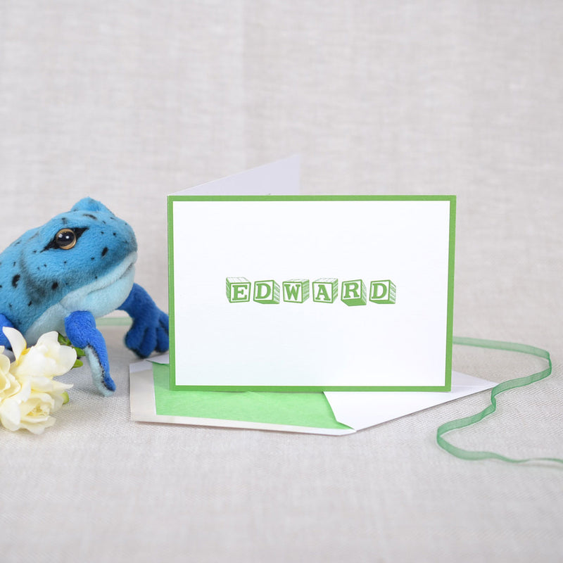 The Forsyth personalised new baby cards, showing grass green baby block font with matching border