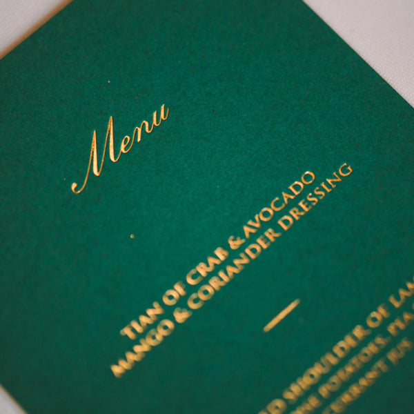 A close up shot of the gold foiling on the elvetham wedding menu