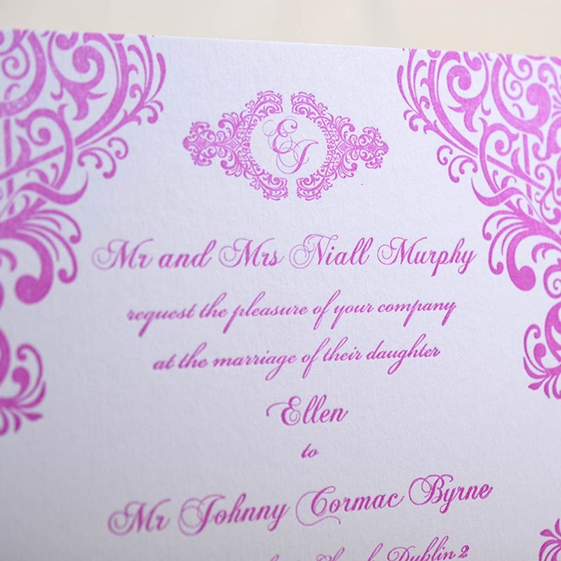 a close up of the grafton letterpressed wedding invitation and its monogram