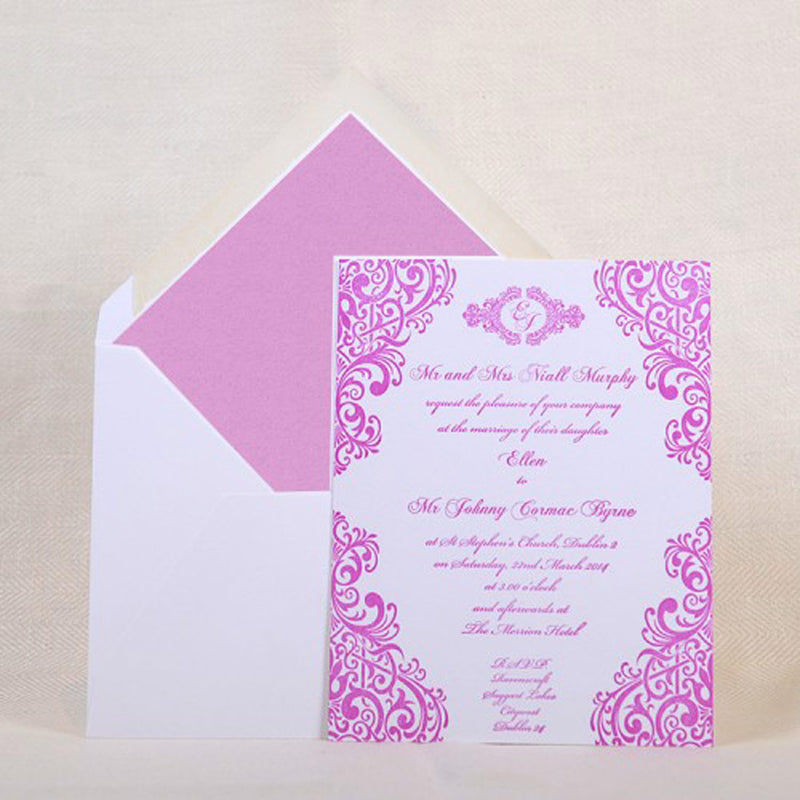 The Grafton letterpressed wedding invitation is shown with a plum tissue paper lined envelope