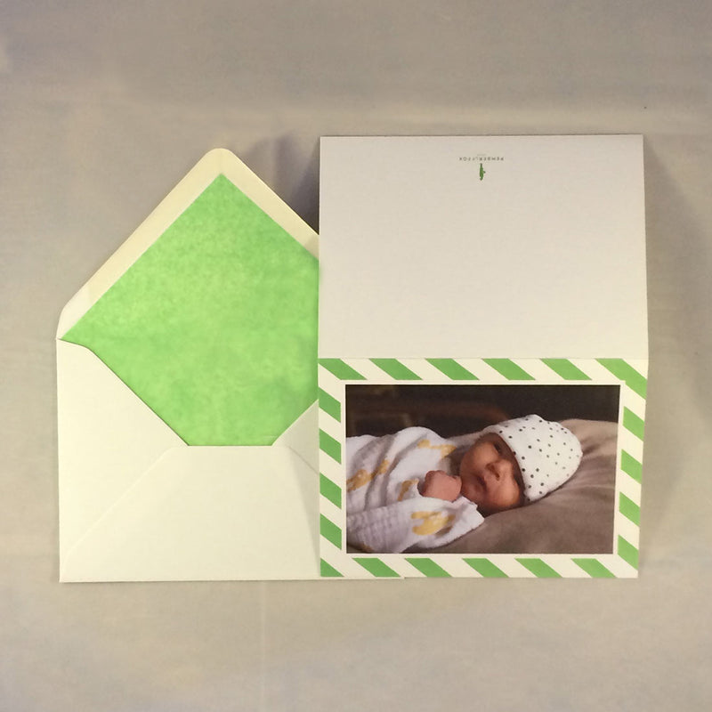 The isabella personalised baby girl card and spring green tissue paper lining to complement the border colour