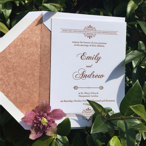 The Kenwood letterpressed wedding invitations shown with a matching tissue paper lined envelope