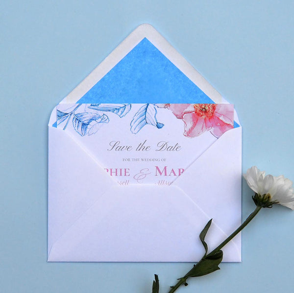 The Kew save the date card with Pacific Blue tissue lining in the envelopes