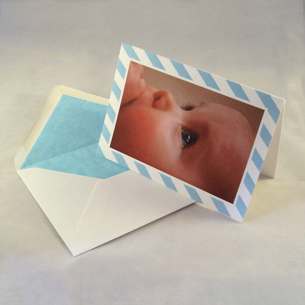 The Luke baby boy thank you cards, showing baby blue striped borders which complement the tone in the picture