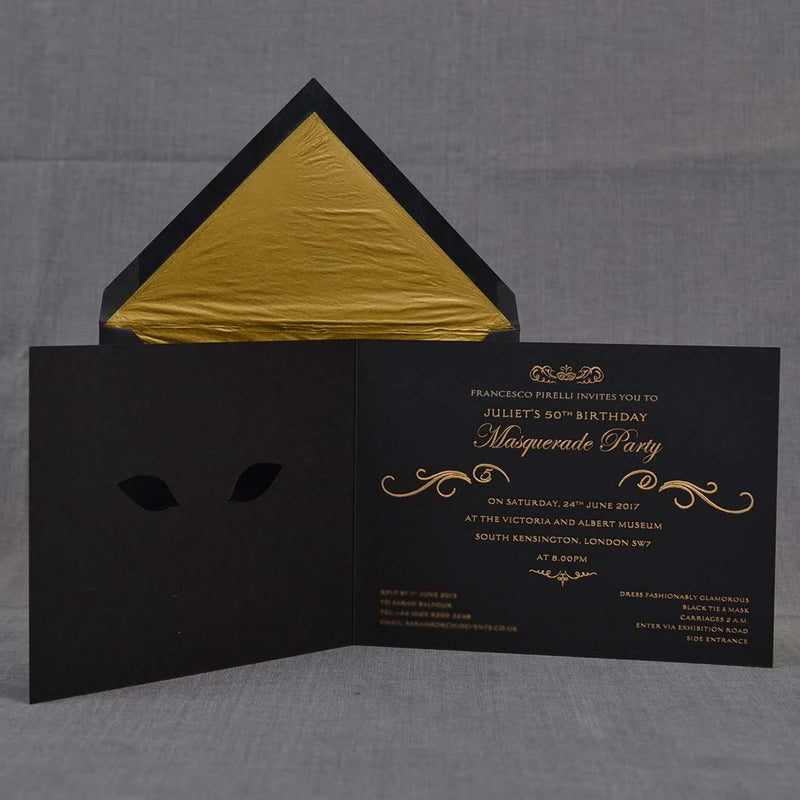 The gold engraved text on the inside back cover of the Masquerade Ball party invitations with their black envelopes which are gold tissue lined