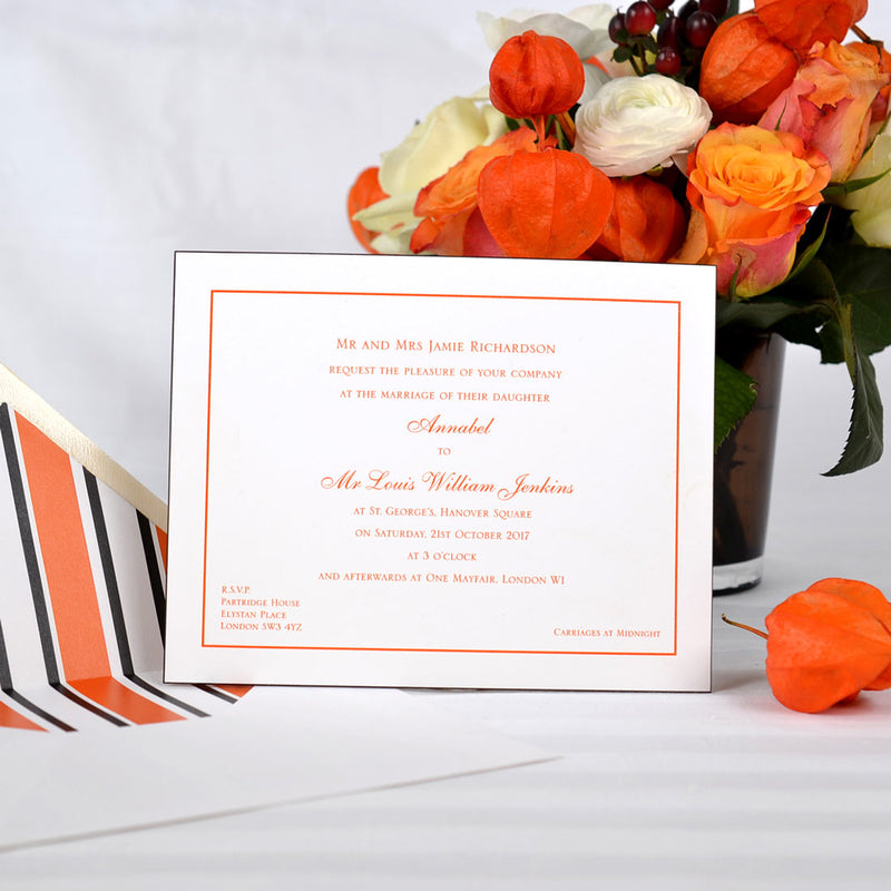 The Mayfair wedding invitation, prints in orange onto white card with black edges and printed paper lined envelopes