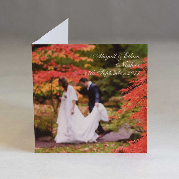 This square thank you card shows a photo covering the front cover with names, date and location printed top right