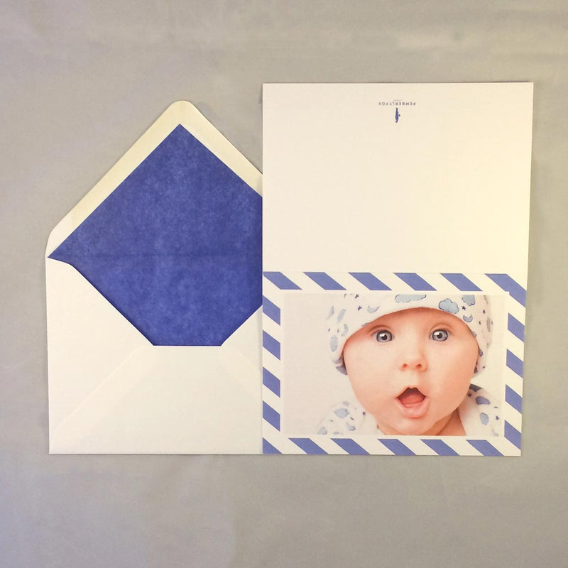 The Noah luxury baby boy cards with mid blue tissue paper lined envelope to complement the border colour
