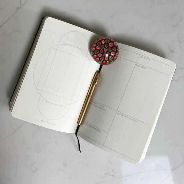 Printed pages on the inside allow or a table plan and a page for notes for every evening