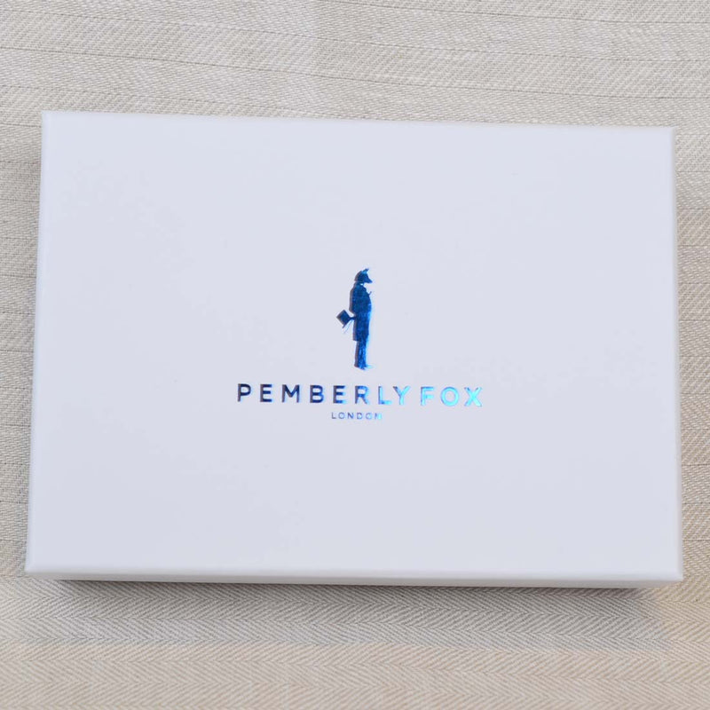 Pemberly Fox's branded boxes with a metallic blue foiled logo