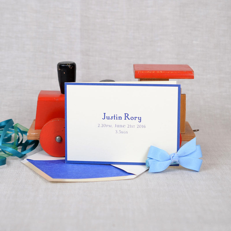 The Portnall personalised new baby cards, showing a blue font with matching border