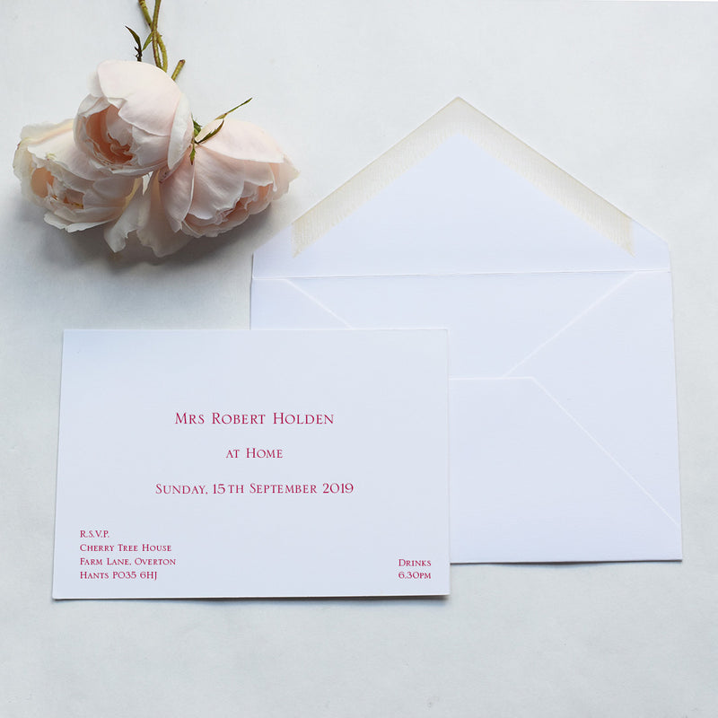 Using a serif font in this image, the Rosings at home invitation cards print in burgundy