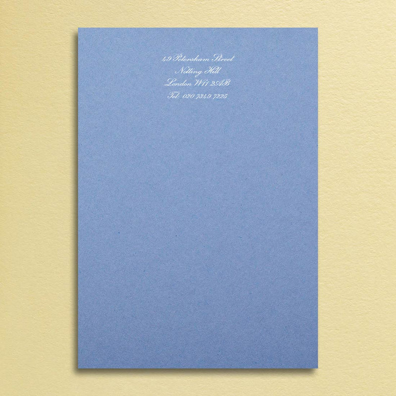Stylish and simple, your contact details print in red at the head in white ink onto a warm blue sheet