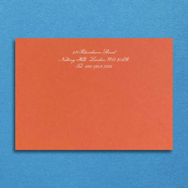 Printed in white onto a mandarin orange card with your details centred at the head of the card