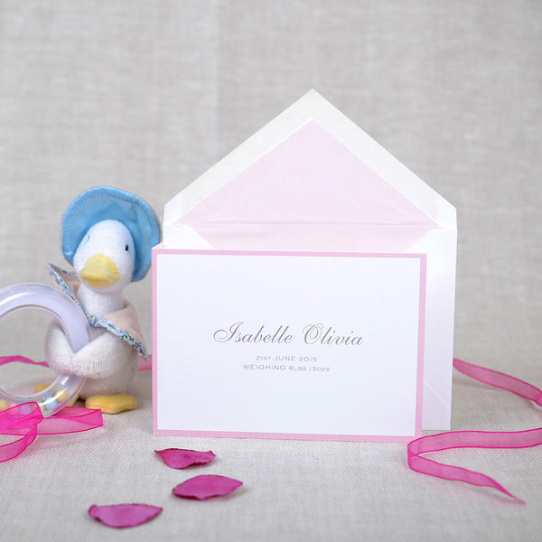 The folded Spencer birth announcement cards and envelope with baby pink tissue paper lining