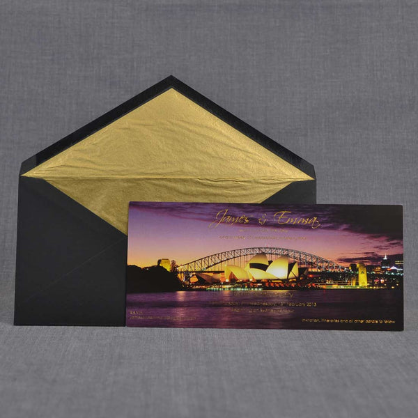 The Sydney Party invitations shown with the gold tissue paper lined black envelopes
