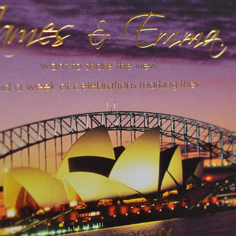 A close up of the The Sydney Party invitations showing the gold foiling on the photo of the harbour