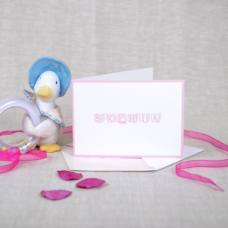 The Tancross personalised new baby cards, showing a grey font and baby pink border