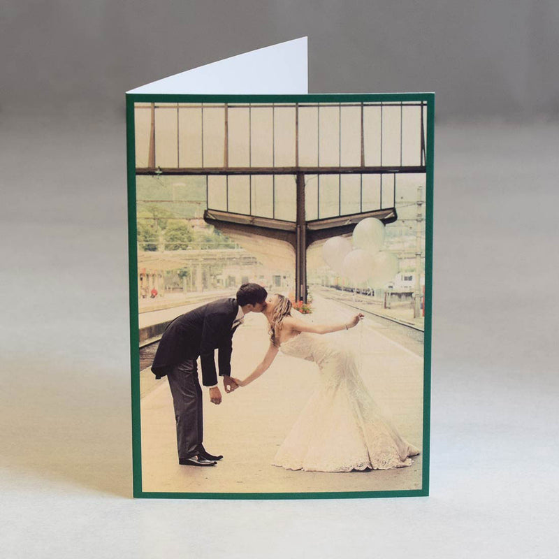 The folded Verona wedding photo thank you cards are printed with a colour photo and green border to bleed