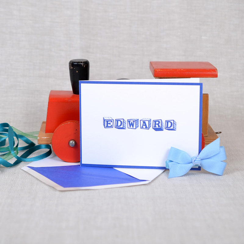 The Welling personalised new baby cards, showing an blue baby block font and matching border