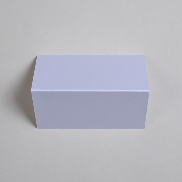 The Pristine white Wedding name place cards shown flat on a table surface with the crease in the middle