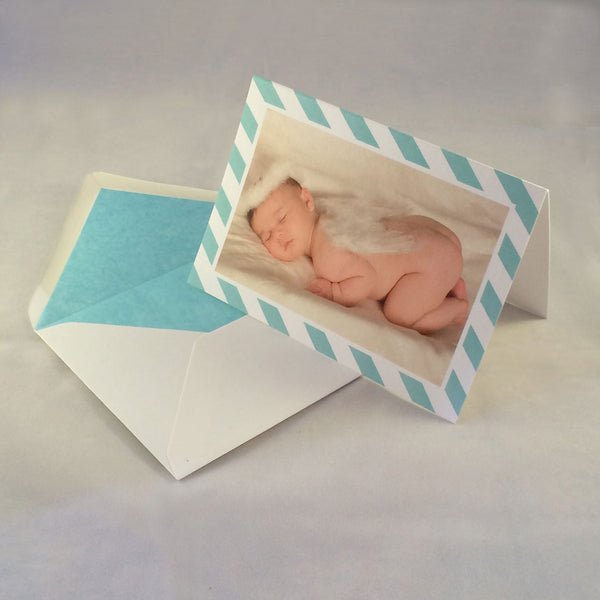 The William baby boy thank you cards, showing aqua striped borders which complement the tone in the picture