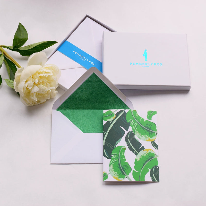 the banana leaf greeting cards show the leaf pattern with matching green tissue lined white envelopes